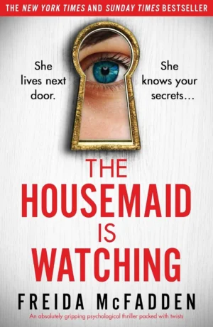The Housemaid Is Watching book cover by Freida McFadden - a dark, voyeuristic image of a large, windowed estate with a silhouette watching from within.